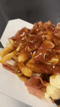 Close-up of poutine with gravy and cheese curds