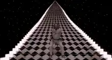 Man dancing on a checkered pyramid