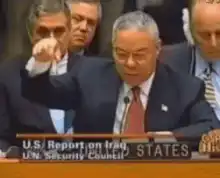 Colin Powell shaking finger at UN