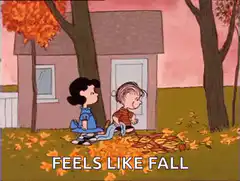 Charlie Brown and Lucy in autumn leaves