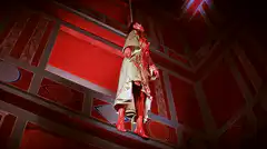 Bloody hanging man in red room