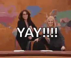 Two women dancing and celebrating