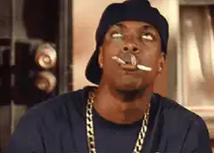 Snoop Dogg rolling two cigarettes