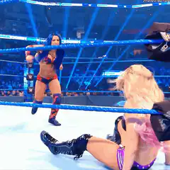 WWE wrestler jumping over ropes