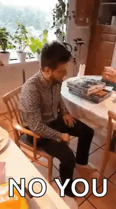 Man holds up Uno reverse card