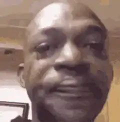 Man nodding and looking around