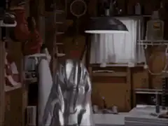 Woman peeling off a silver mask