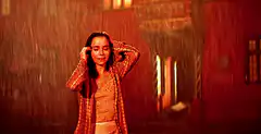 Woman dancing in the rain