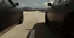 Two cars driving on a bridge