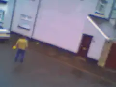 Person throwing yellow frisbee