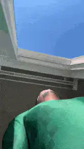 Man with pixelated face looking up