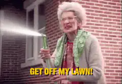Old lady yelling get off my lawn with hose