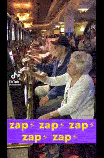 elderly people playing slot machines in a row