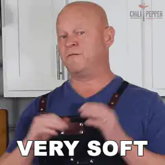 Bald man squeezing apron very soft