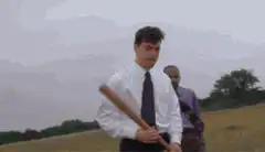 Man hands baseball bat to another man