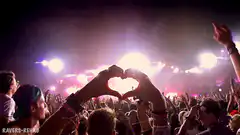 Hands making heart shape at concert