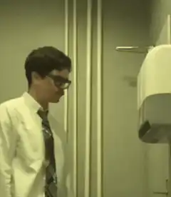Man punches paper towel dispenser
