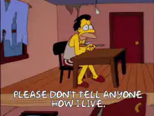Homer Simpson eating at a table