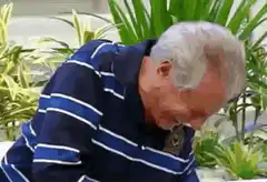 Older man laughing hysterically
