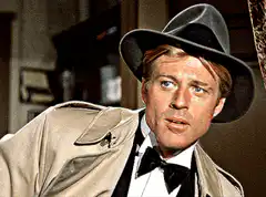 Robert Redford in a fedora and tuxedo