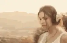 Woman listening to music with headphones