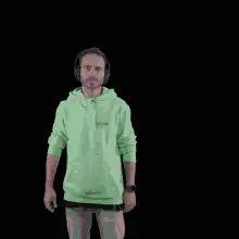Man in green hoodie dancing