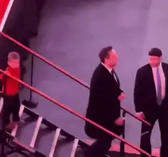 Donald Trump trips on stage stairs