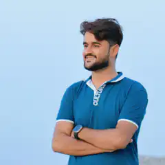 Man in blue polo shirt smiling
