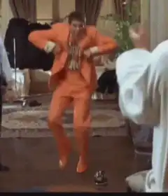 Vincent Vega dancing in orange suit