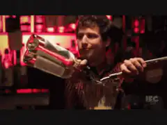 Andy Samberg pouring drinks