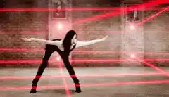 Woman dodging red laser beams