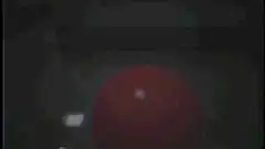 red lollipop in dark room