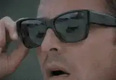 Tony Stark puts on sunglasses