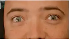 Man's eyes darting around nervously