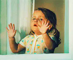 Crying toddler behind glass