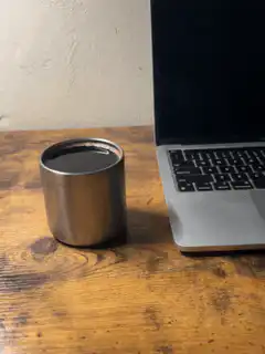 Steam rising from a metal cup