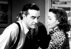 Man and woman kiss in black and white