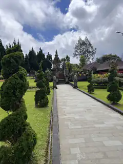 Balinese temple pathway with spiral trees