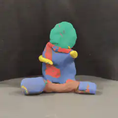 Clay figure doing jumping jacks
