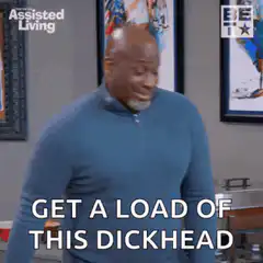 Bald man points thumb at himself