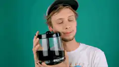 Man hugging coffee pot