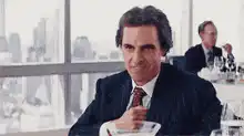 Jordan Belfort smiling while eating