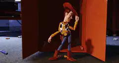 Woody leaning against a wall