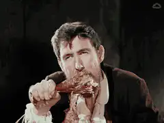 man eating meat with hands