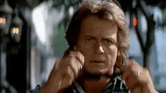 Kurt Russell puts on sunglasses
