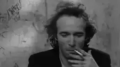 Man smoking and drinking coffee