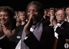 Morgan Freeman clapping at an awards show