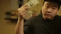 Man makes dollar bill disappear