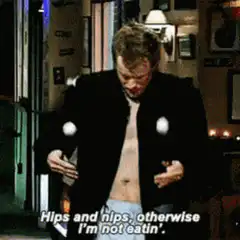 Ross opens his jacket to show his chest