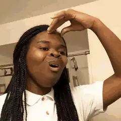 Woman measuring small amount on forehead